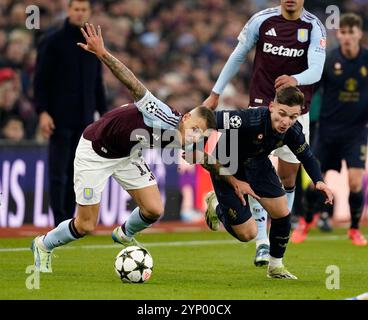 Birmingham, UK. 27th Nov, 2024. Aston Villa's Lucas Digne with Juventus' Francisco Conceicao during the UEFA Champions League match at Villa Park, Birmingham. Picture credit should read: Andrew Yates/Sportimage Credit: Sportimage Ltd/Alamy Live News Stock Photo