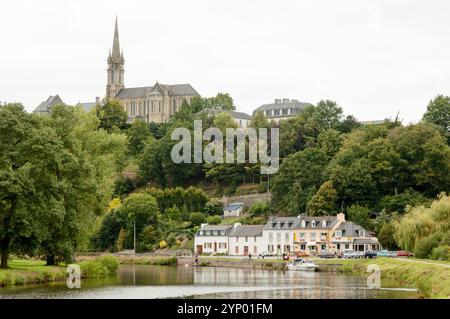 A view of the church of Saint Julien from the Nantes-Brest canal in Châteauneuf-du-Faou, France Stock Photo