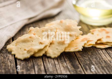 A crispy salted crackers  on a wooden table. Stock Photo