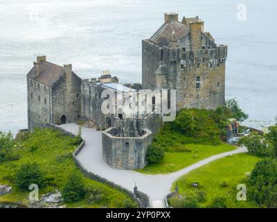 Eilean Donan castle with connecting footbridge on a tidal island between Loch Duich, Loch Long and Loch Alsh in Highlands of Scotland, near Dornie, UK Stock Photo