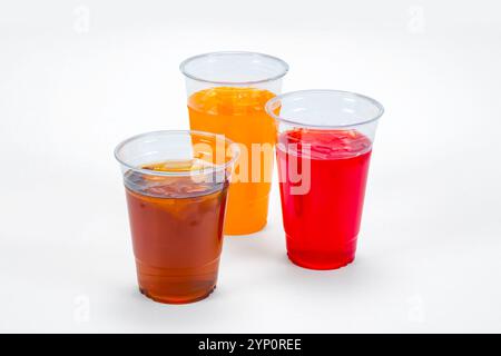 Three clear cups with juice, soda pop  and ice tea Stock Photo