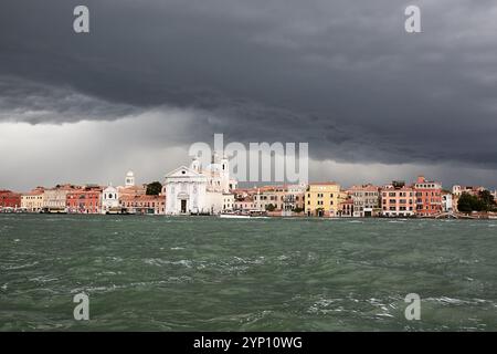 01.07.2024, Italy, Veneto, Venice - Venice, Veneto, Italy - View over the canal from Giudecca to Venice-Dorsoduro with stormy sky and approaching thun Stock Photo