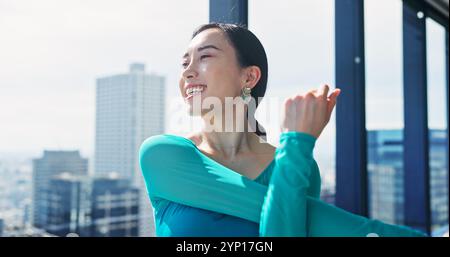 Fitness, woman and arms stretching for practice, training and choreography in ballet dance studio. Warm up, muscle flexibility and Japanese dancer for Stock Photo