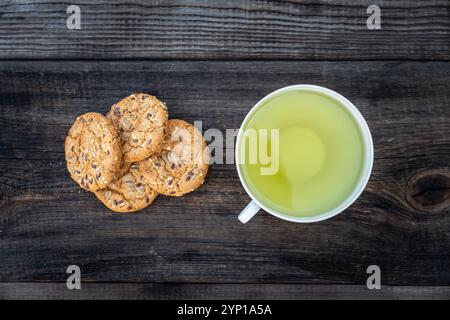 Oatmeal Cookies with Brazilian nuts and tea on a wooden table. top view Stock Photo