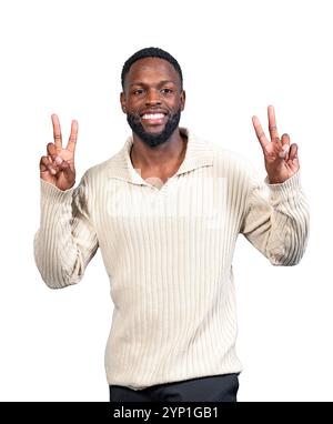 Portrait of a cheerful young adult making the victory sign with both hands, isolated on white background Stock Photo