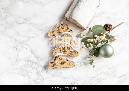 German Stollen for Christmas with powdered sugar marble table Stock Photo