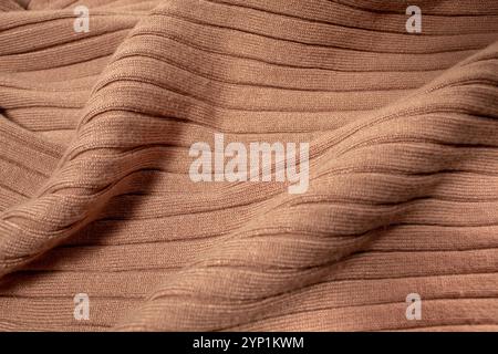 Texture of brown knitted sweater. Background Stock Photo