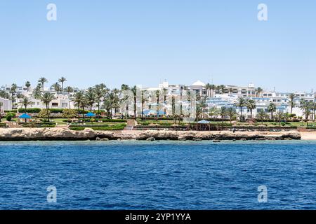 Beautiful rocky coast in the resort town of Sharm el Sheikh, Egypt. View from the sea. Egyptian landscape in Sinai. Stock Photo