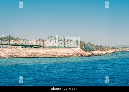 Beautiful rocky coast in the resort town of Sharm el Sheikh, Egypt. View from the sea. Egyptian landscape in Sinai. Stock Photo