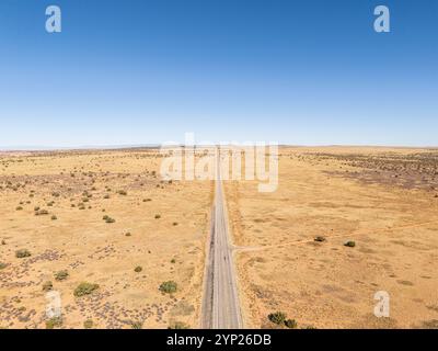 Aerial view of a road near Canyonlands National Park, Utah, wilderness and remote location. Bright sunshine Stock Photo