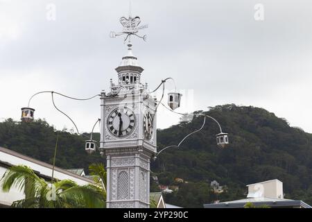 Old Clock tower is under cloudy sky, one of the most popular landmarks of the old town of Victoria, Seychelles Stock Photo