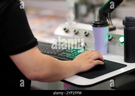Operator controls modern computerized industrial equipment. Selective focus. Stock Photo