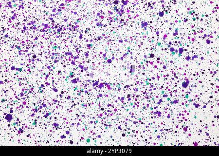 Purple splashes of  paint  on a white background. Spotted abstract art. Stock Photo