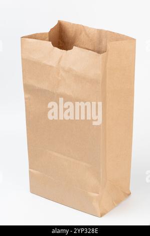 Open brown paper bag isolated on white studio background Stock Photo