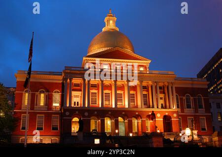 The Massachusetts State House in Boston is illuminated at dusk and is home to the state government and politics Stock Photo