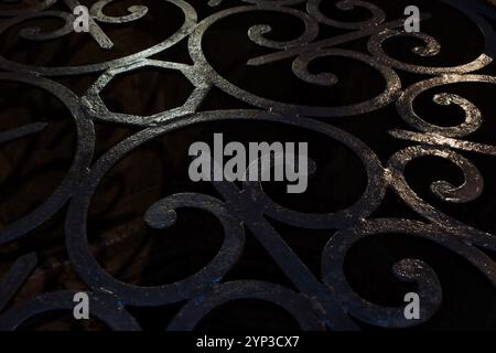 Close up of a wrought iron grate protecting a well in an old building in Siena Stock Photo