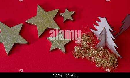 Golden stars on a red background. Christmas decoration. Stock Photo