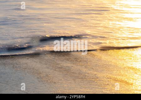 Coastal impressionist blue and gold ethereal  waves and motion background Stock Photo
