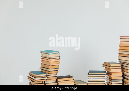 Stacks of old educational books for college library on white background Stock Photo