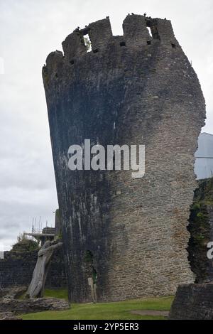 Wales, Caerphilly - July 01, 2024: A huge sculpture appears to support the leaning tower. Stock Photo