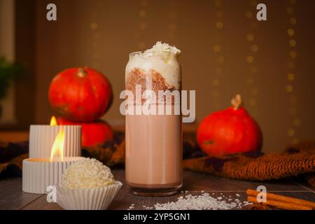 Strawberry milkshake with marshmallows and candy and popcorn in a clear glass. Photo of dessert food Stock Photo