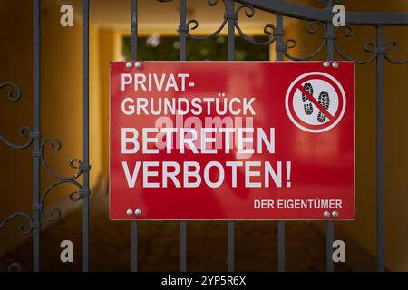 Sign with the German inscription Privatgrundstück, Betreten Verboten. Translation: Private property No trespassing Stock Photo