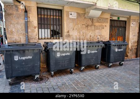 Logrono, Spain- May 26, 2024: Four gray waste bind on a street in Logrono Stock Photo