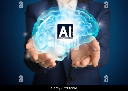 Artificial intelligence. Businesswoman holding virtual brain with AI abbreviation on dark blue background, closeup Stock Photo