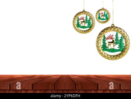 Three elegant Christmas ornaments with reindeer and tree designs hang above a wooden table on a white background. Stock Photo
