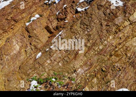 Brown Textured Mineral rock layer details patterns background. cliff rock stone Stock Photo