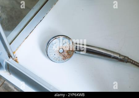 Dirty shower head with and rust on it Stock Photo - Alamy