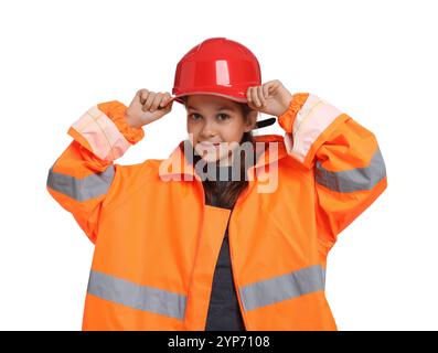 Girl with hardhat and vest pretending to be firefighter on white background. Dreaming of future profession Stock Photo