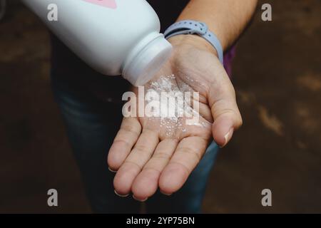 In this photo illustration, a person uses Johnson Johnson baby powder ...