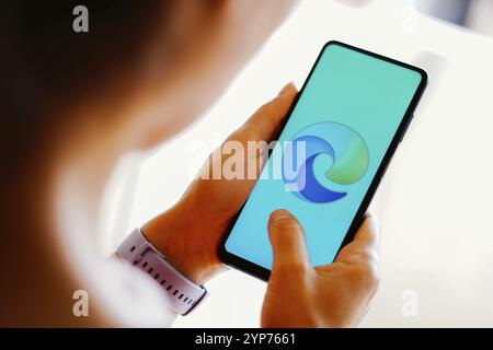 In this photo illustration, the Microsoft Edge logo is displayed on a smartphone screen Stock Photo