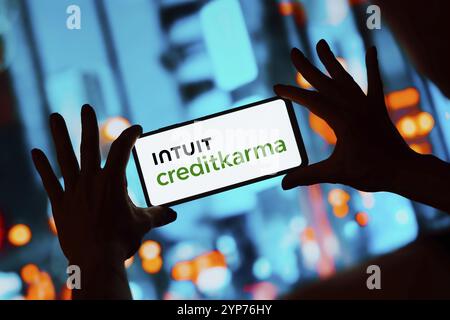 In this photo illustration, the Intuit Credit Karma logo is displayed on a smartphone screen Stock Photo