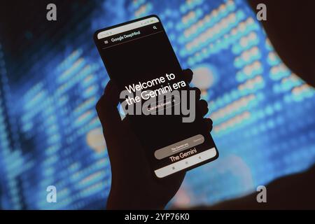 In this photo illustration, the a person accesses the official Google DeepMind website and the message Welcome to the Gemini era is displayed on the s Stock Photo