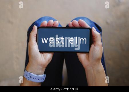 In this photo illustration, the West Elm logo seen displayed on a smartphone Stock Photo