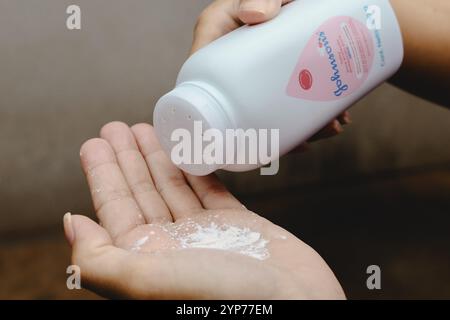 In this photo illustration, a person uses Johnson Johnson baby powder ...