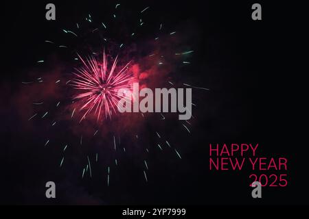 Happy New Year 2025, text with red fireworks and smoke against the black night sky, festive holiday highlight, copy space Stock Photo