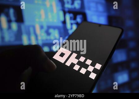 In this photo illustration, the OKX logo is displayed on a smartphone screen Stock Photo