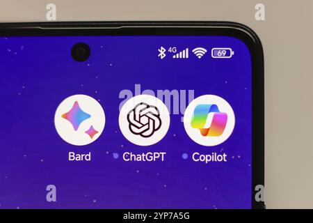 In this photo illustration, Google Bard, ChatGPT and Copilot apps displayed on a smartphone screen Stock Photo