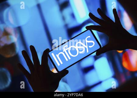 In this photo illustration, the Infosys Limited logo is displayed on a smartphone screen Stock Photo