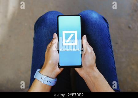 In this photo illustration, the Deutsche Bank AG logo is displayed on a smartphone mobile screen Stock Photo