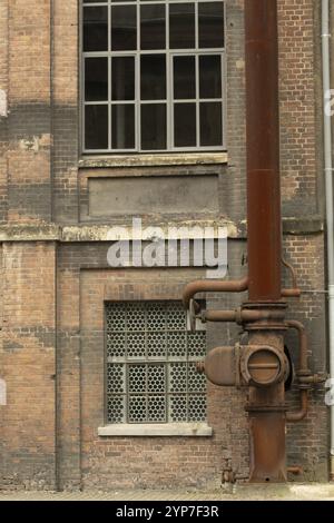 Details of an old industrial building, brick wall and windows, approx. 100 years old Stock Photo