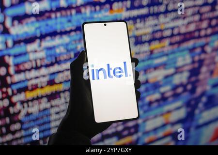 In this photo illustration, the Intel Corporation logo is displayed on a smartphone screen Stock Photo