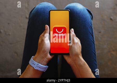 In this photo illustration, the AliExpress logo is displayed on a smartphone mobile screen Stock Photo