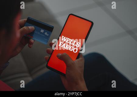 In this photo illustration, the Wells Fargo logo is displayed on a smartphone screen Stock Photo