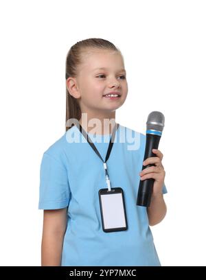 Little girl with microphone pretending to be journalist on white background. Dreaming of future profession Stock Photo