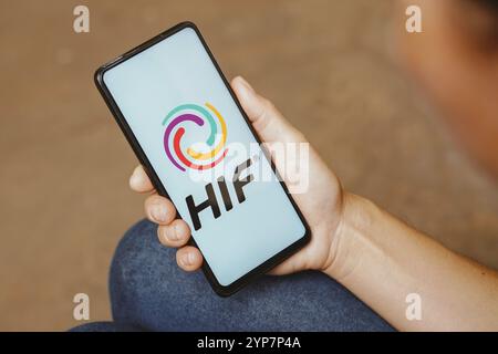 In this photo illustration, the HIF Global logo is displayed on a smartphone screen Stock Photo