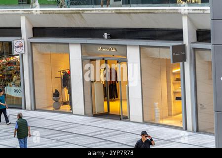 London, UK - June 22, 2018: Storefront sign for Lacoste French clothing clothes boutique store on Regent street road in England with people pedestrian Stock Photo